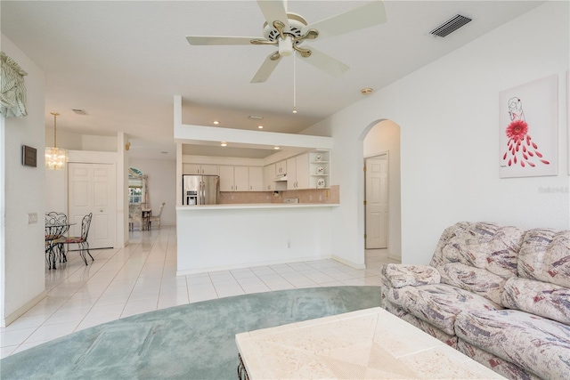 1156 Ridgegrove Dr W, Palm Harbor, FL 34683 - living area featuring light tile patterned flooring, a ceiling fan, arched walkways, and recessed lighting