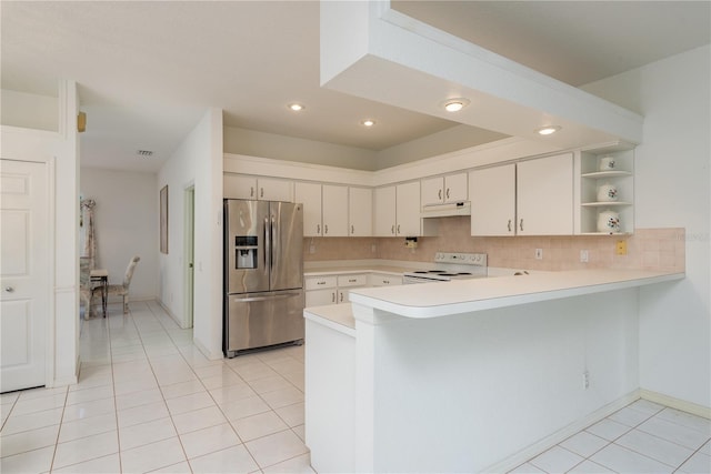 1156 Ridgegrove Dr W, Palm Harbor, FL 34683 - kitchen with stainless steel fridge with ice dispenser, electric range, a peninsula, under cabinet range hood, and light countertops