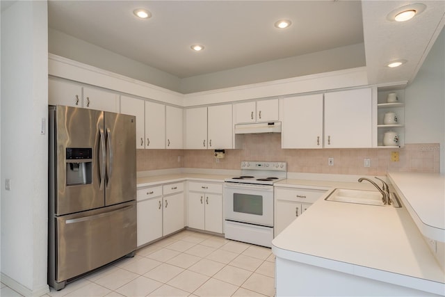 1156 Ridgegrove Dr W, Palm Harbor, FL 34683 - kitchen featuring stainless steel fridge, white electric range oven, under cabinet range hood, open shelves, and decorative backsplash