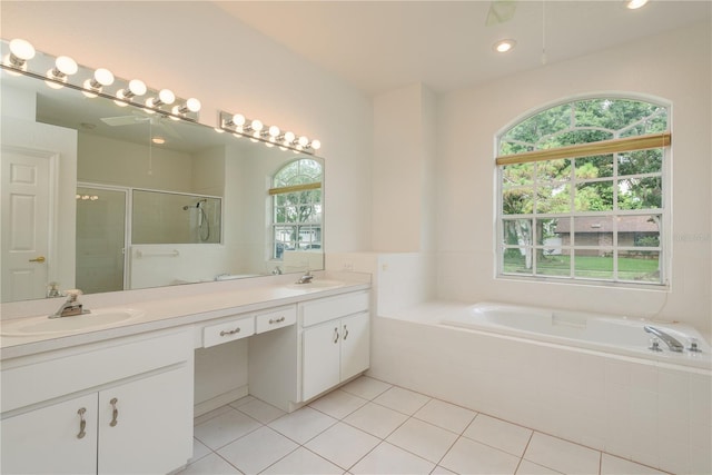 1156 Ridgegrove Dr W, Palm Harbor, FL 34683 - full bath featuring healthy amount of natural light, double vanity, tile patterned flooring, a shower stall, and recessed lighting