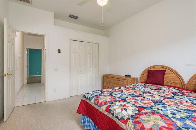 1156 Ridgegrove Dr W, Palm Harbor, FL 34683 - bedroom featuring light colored carpet, a closet, and a ceiling fan