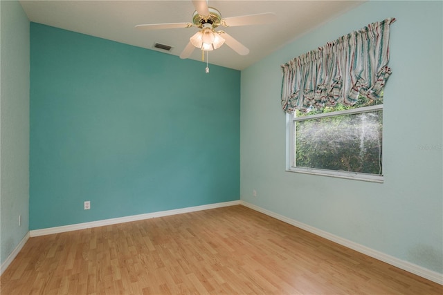 1156 Ridgegrove Dr W, Palm Harbor, FL 34683 - empty room featuring wood finished floors and ceiling fan