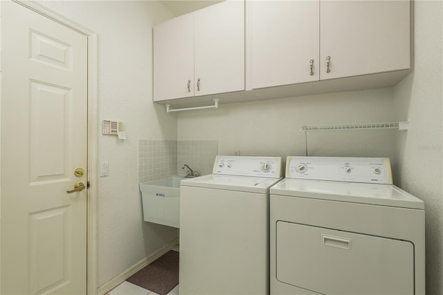 1156 Ridgegrove Dr W, Palm Harbor, FL 34683 - laundry room featuring cabinet space and separate washer and dryer