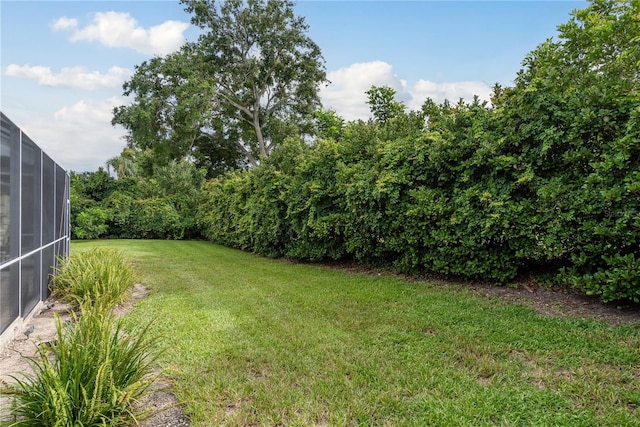 1156 Ridgegrove Dr W, Palm Harbor, FL 34683 - view of green lawn featuring glass enclosure