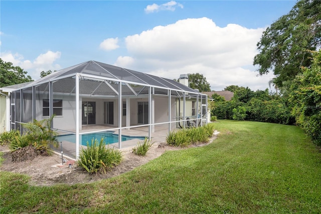 1156 Ridgegrove Dr W, Palm Harbor, FL 34683 - back of house featuring a chimney, a yard, an outdoor pool, a patio, and glass enclosure