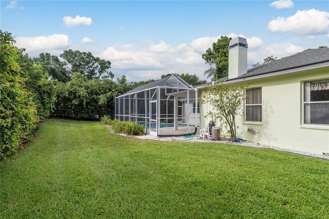 1156 Ridgegrove Dr W, Palm Harbor, FL 34683 - view of green lawn featuring a lanai and an outdoor pool