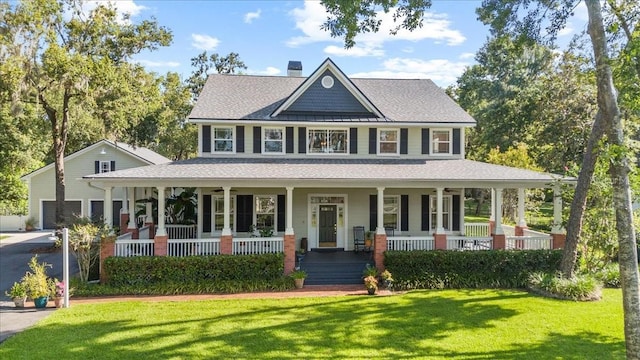 523 2nd Ave SW, Lutz, FL 33548 - view of front of home with covered porch, a front yard, roof with shingles, and a chimney