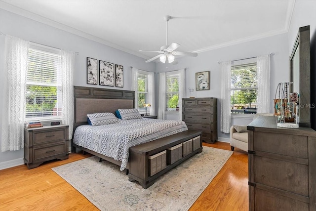 523 2nd Ave SW, Lutz, FL 33548 - bedroom featuring crown molding, light wood-style flooring, and ceiling fan
