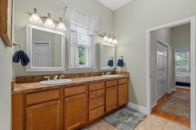 523 2nd Ave SW, Lutz, FL 33548 - ensuite bathroom with double vanity and baseboards