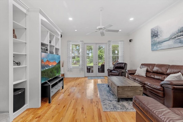 523 2nd Ave SW, Lutz, FL 33548 - living room with french doors, ceiling fan, recessed lighting, light wood-style floors, and ornamental molding