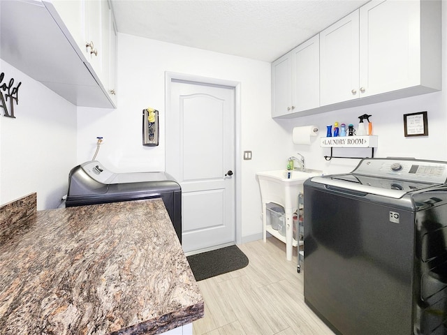 8110 Damara Dr, New Port Richey, FL 34653 - washroom featuring washing machine and clothes dryer and cabinet space