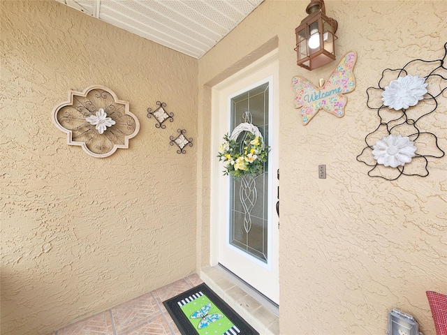 8110 Damara Dr, New Port Richey, FL 34653 - view of exterior entry featuring stucco siding