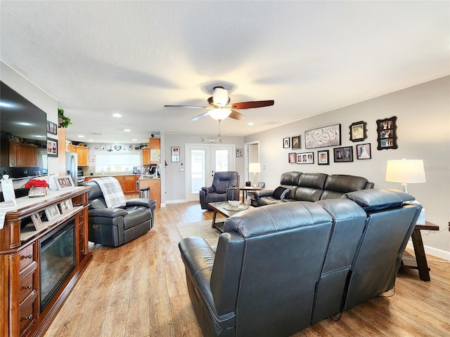 8110 Damara Dr, New Port Richey, FL 34653 - living area with light wood-style flooring, a ceiling fan, and recessed lighting