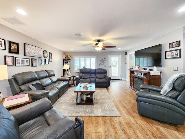 8110 Damara Dr, New Port Richey, FL 34653 - living area featuring light wood-style flooring, ceiling fan, and recessed lighting