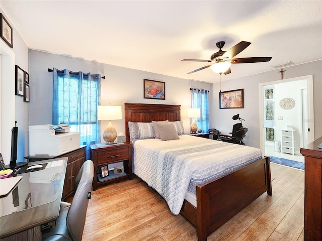 8110 Damara Dr, New Port Richey, FL 34653 - bedroom featuring light wood-type flooring and ceiling fan