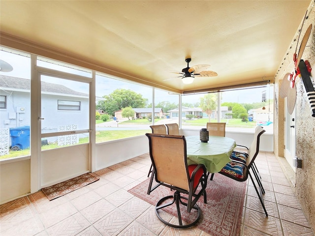 8110 Damara Dr, New Port Richey, FL 34653 - sunroom featuring ceiling fan, plenty of natural light, and outdoor dining space