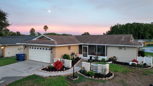 8110 Damara Dr, New Port Richey, FL 34653 - ranch-style home featuring an attached garage, driveway, roof with shingles, stucco siding, and brick siding