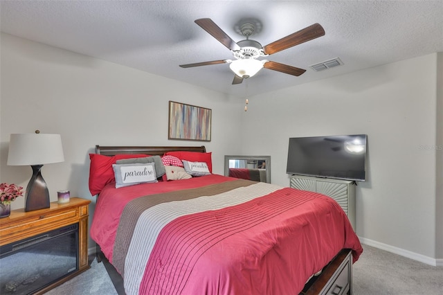 4485 Eternal Prince Dr, Sun City Center, FL 33573 - bedroom with carpet, ceiling fan, and a textured ceiling
