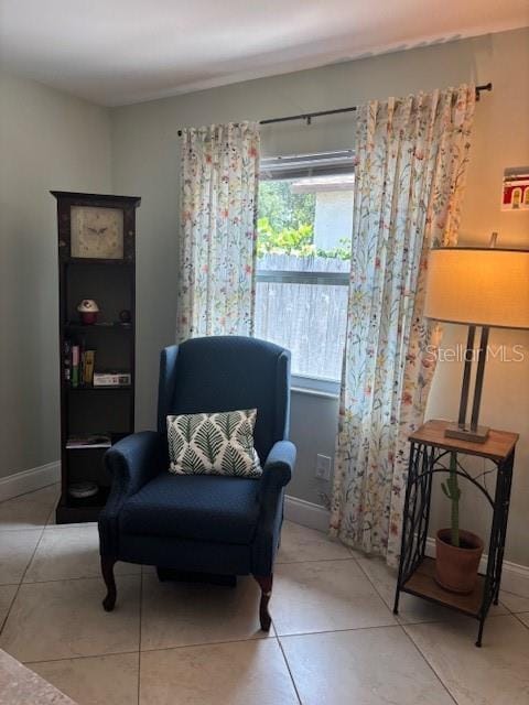 1021 16th Ave SW, Largo, FL 33770 - living area with baseboards and light tile patterned flooring