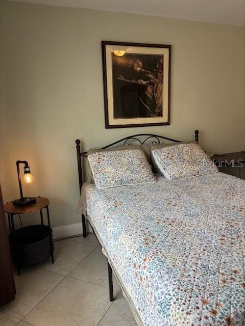 1021 16th Ave SW, Largo, FL 33770 - bedroom featuring light tile patterned floors and baseboards