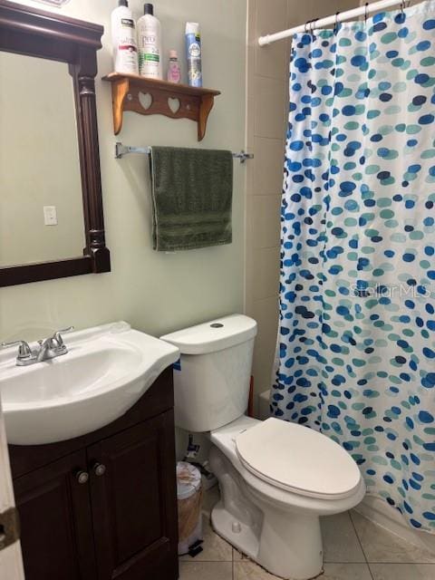 1021 16th Ave SW, Largo, FL 33770 - full bathroom with vanity, tile patterned floors, and curtained shower