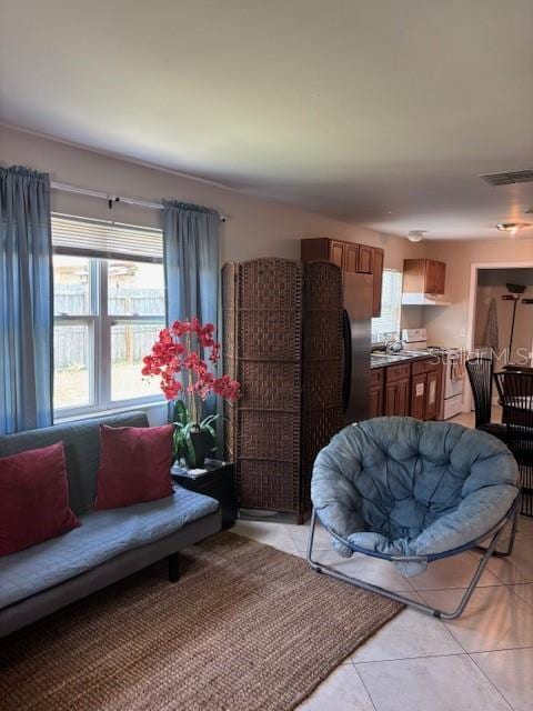 1021 16th Ave SW, Largo, FL 33770 - living room featuring light tile patterned floors