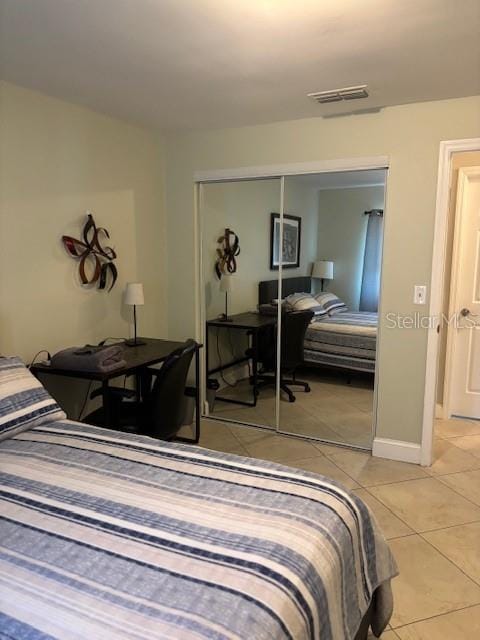 1021 16th Ave SW, Largo, FL 33770 - bedroom with a closet and light tile patterned floors