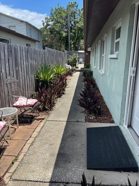 1021 16th Ave SW, Largo, FL 33770 - fenced backyard with a patio area