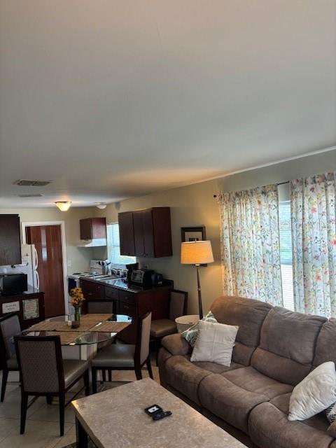 1021 16th Ave SW, Largo, FL 33770 - living room with light tile patterned flooring