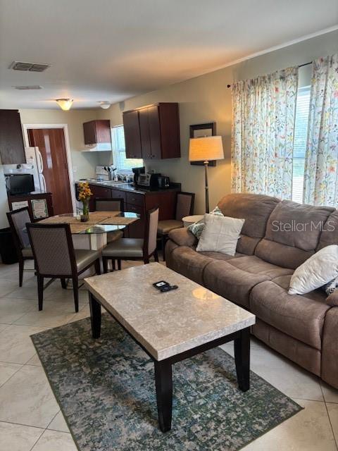 1021 16th Ave SW, Largo, FL 33770 - living area with light tile patterned floors