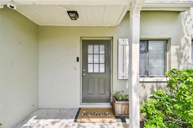 1508 Adams Cir E, Largo, FL 33771 - doorway to property with stucco siding
