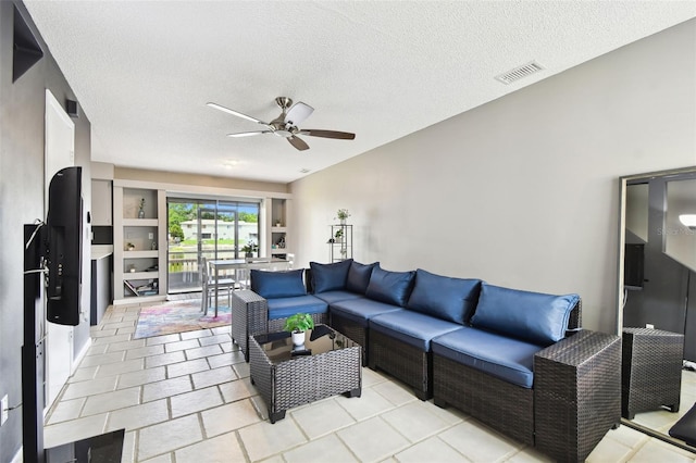1508 Adams Cir E, Largo, FL 33771 - living room with a ceiling fan and a textured ceiling