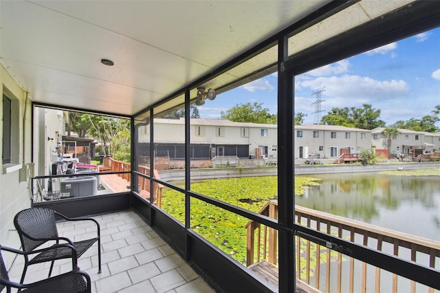 1508 Adams Cir E, Largo, FL 33771 - sunroom with a water view and a residential view