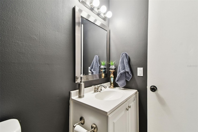 1508 Adams Cir E, Largo, FL 33771 - bathroom with vanity and a textured wall