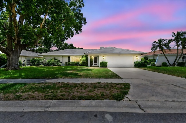 2418 Cardwell Way, Sarasota, FL 34231 - single story home featuring an attached garage, concrete driveway, and a yard