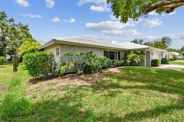 2418 Cardwell Way, Sarasota, FL 34231 - view of front of property with a front lawn, an attached garage, concrete driveway, and stucco siding