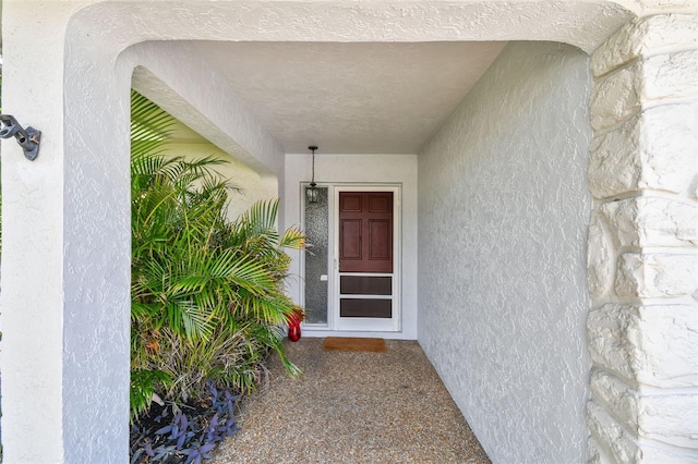 2418 Cardwell Way, Sarasota, FL 34231 - doorway to property featuring stucco siding