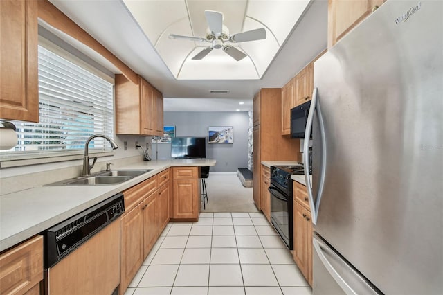2418 Cardwell Way, Sarasota, FL 34231 - kitchen featuring black appliances, ceiling fan, light tile patterned floors, light countertops, and light carpet