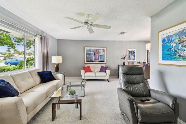 2418 Cardwell Way, Sarasota, FL 34231 - carpeted living room with ceiling fan and a textured ceiling