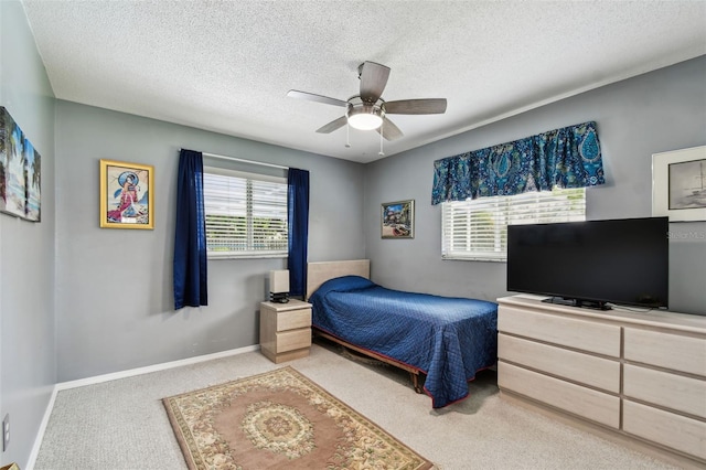2418 Cardwell Way, Sarasota, FL 34231 - bedroom with carpet floors, a textured ceiling, and a ceiling fan