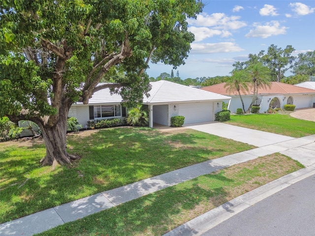 2418 Cardwell Way, Sarasota, FL 34231 - ranch-style house featuring an attached garage, driveway, a front yard, and stucco siding