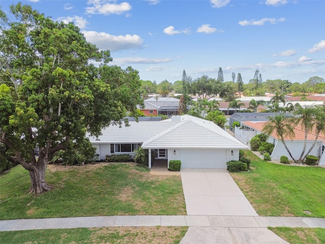 2418 Cardwell Way, Sarasota, FL 34231 - view of front of house with an attached garage, a front yard, driveway, and a tile roof