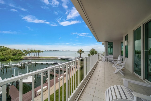 2 Seaside Ln Unit 203, Belleair, FL 33756 - balcony featuring a water view and a dock