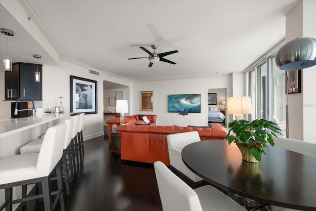 2 Seaside Ln Unit 203, Belleair, FL 33756 - living room with a ceiling fan, dark wood-type flooring, and ornamental molding