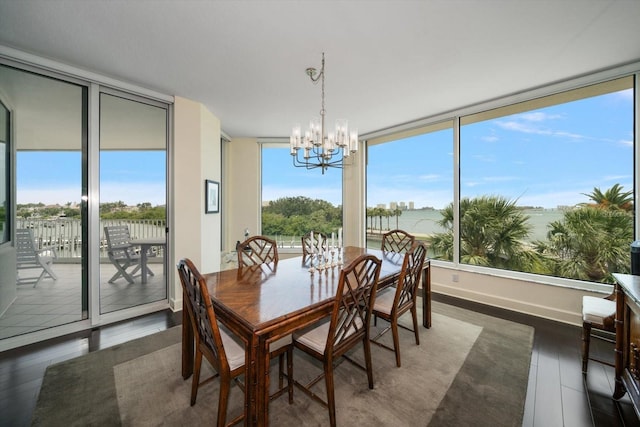 2 Seaside Ln Unit 203, Belleair, FL 33756 - dining room with dark wood-style flooring and a chandelier