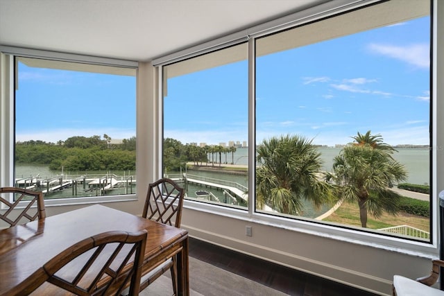 2 Seaside Ln Unit 203, Belleair, FL 33756 - sunroom / solarium featuring a water view and wood finished floors