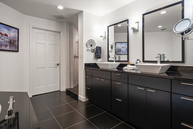 2 Seaside Ln Unit 203, Belleair, FL 33756 - full bathroom featuring tile patterned flooring, a shower stall, double vanity, and recessed lighting
