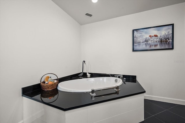 2 Seaside Ln Unit 203, Belleair, FL 33756 - bathroom featuring baseboards and tile patterned flooring