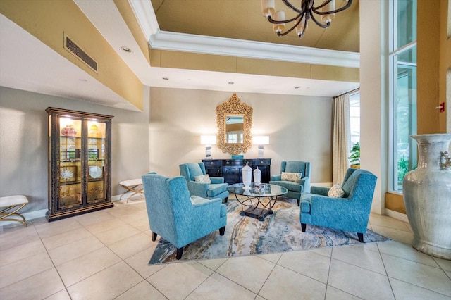 2 Seaside Ln Unit 203, Belleair, FL 33756 - living area featuring crown molding, a chandelier, and tile patterned floors