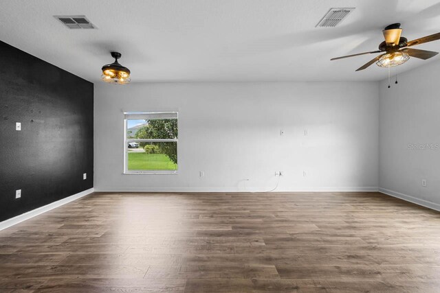 1821 Hawks View Dr, Ruskin, FL 33570 - unfurnished room featuring a ceiling fan and wood finished floors